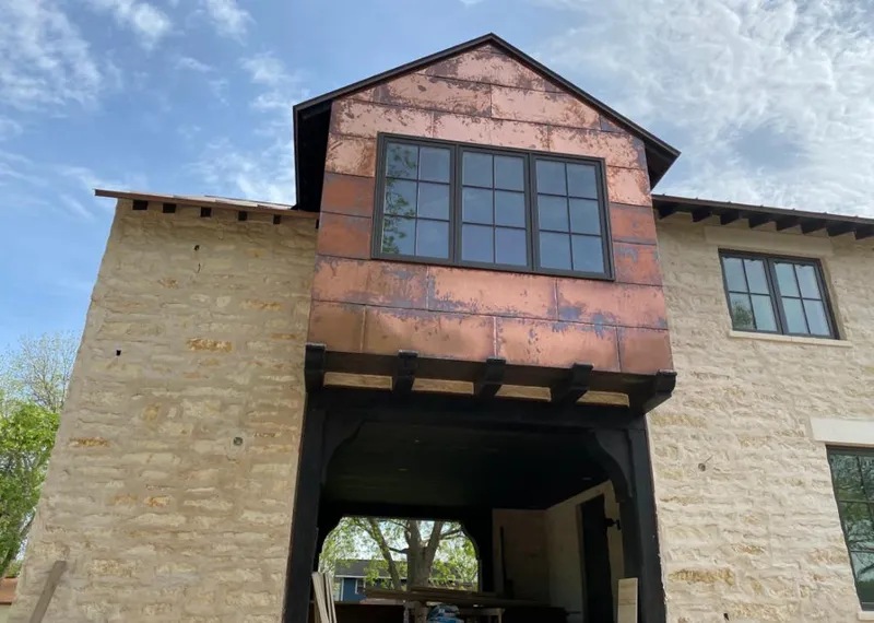 Copper metal panel facade on a stone building for Metal Roof Coating in Del Aire